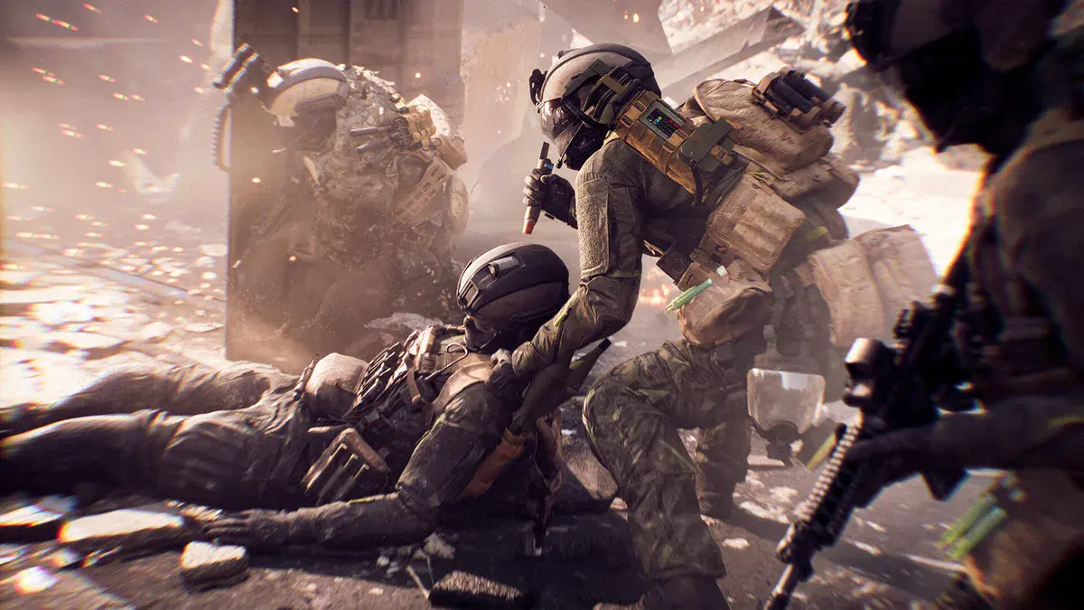 Un soldat en traîne un autre à terre pour le mettre à l'abri sous les tirs, visuel officiel de Battlefield 6
