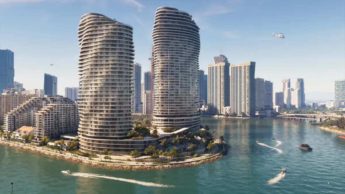 GTA 6 : deux tours d'habitation ondulées au bord de la baie de Vice City, sillonnée de hors-bord, sous un hélicoptère