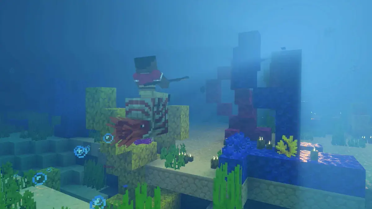 Un joueur armé d'une lance chevauche une créature marine à coquille rayée au-dessus des coraux, dans une eau bleue traversée de rayons de lumière, dans Minecraft sur Switch 2