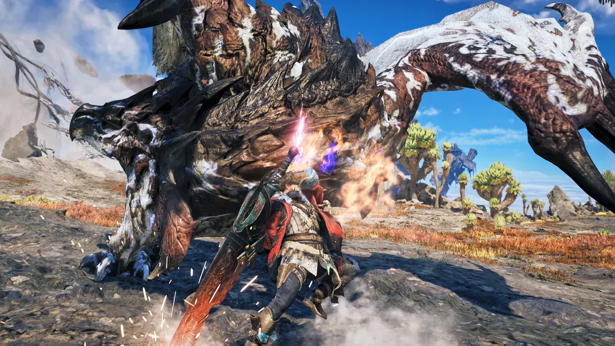 Un chasseur frappe un monstre au cuir tacheté de blanc dans Monster Hunter Wilds: Ascendance
