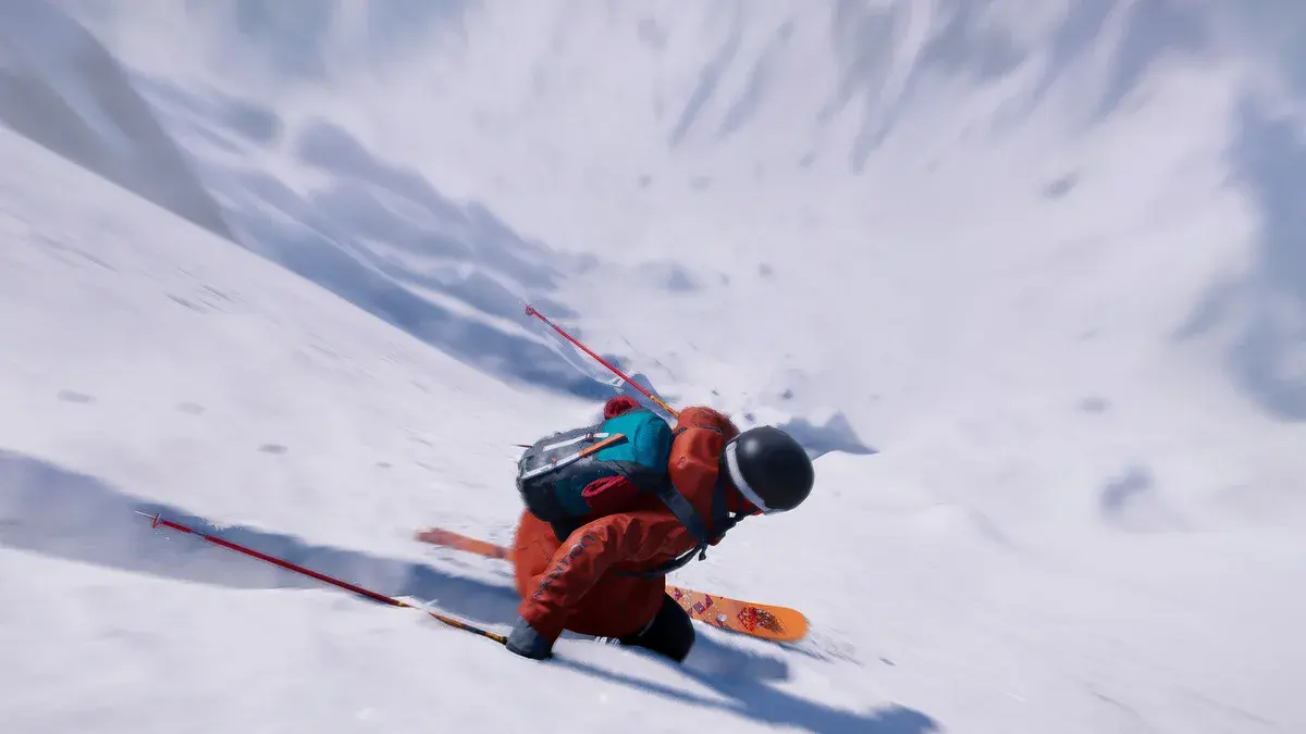Un skieur en combinaison orange dévale une pente enneigée dans Riders Republic