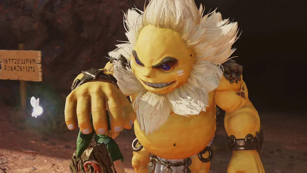 Un Goron à la crinière blanche, sourire en coin, se penche vers Link dans une caverne, dans le remake de Zelda: Ocarina of Time