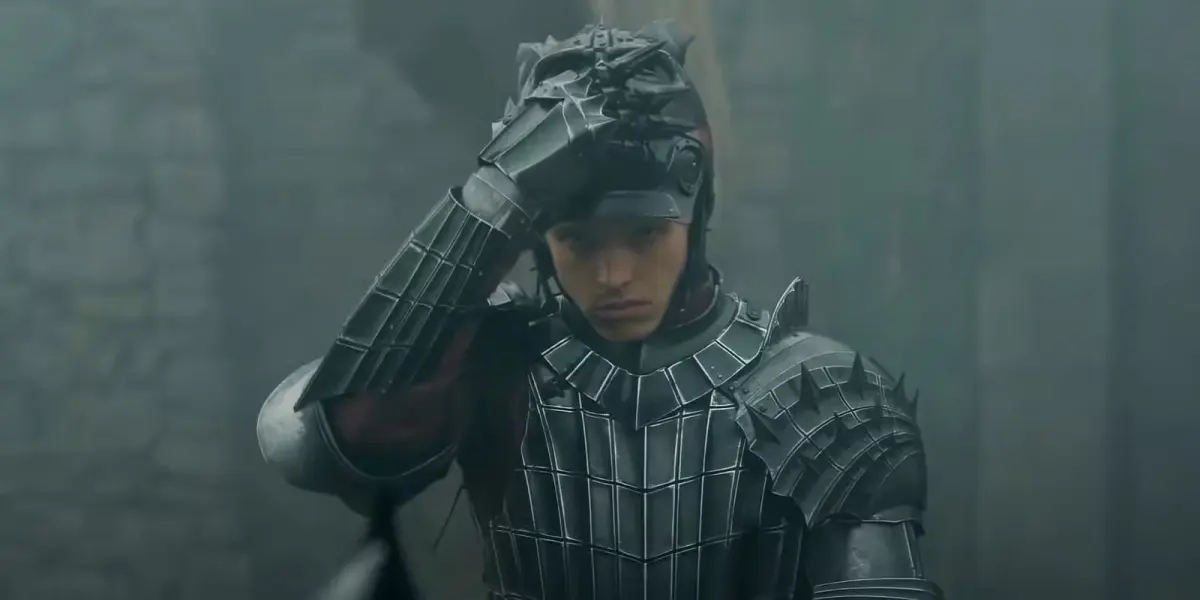 prince aerion targaryen finn bennet putting on his helmet in a knight of the seven kingdoms