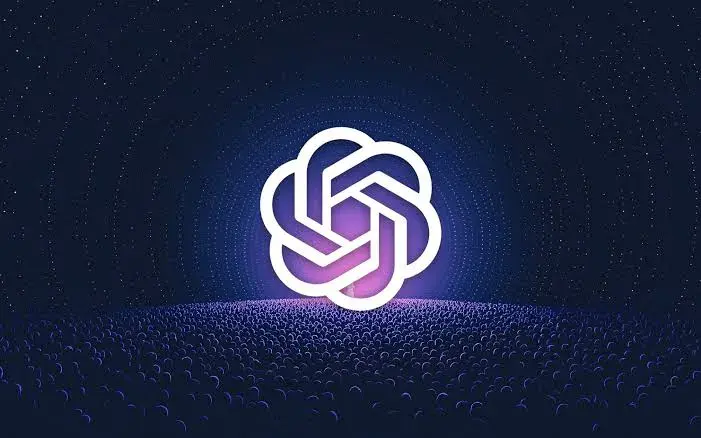 Le logo d'OpenAI, éclairé de violet sur un fond bleu nuit étoilé